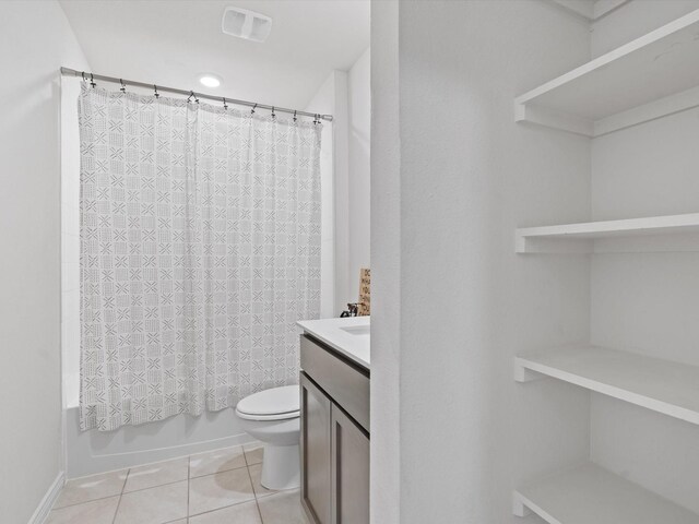 bathroom featuring visible vents, shower / bath combo with shower curtain, toilet, tile patterned flooring, and vanity