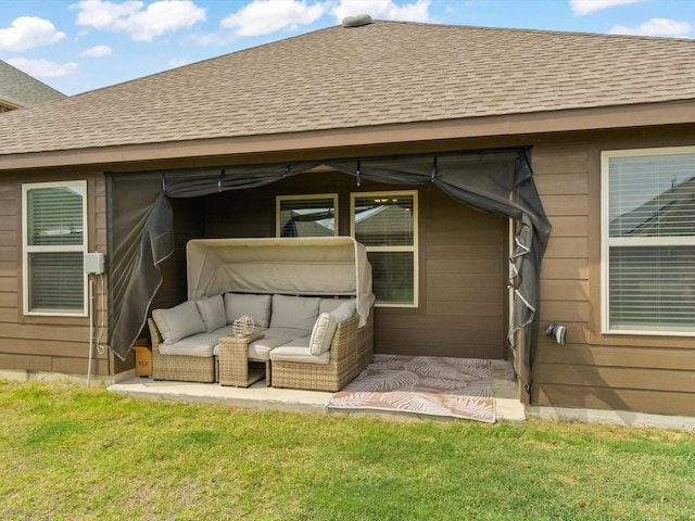 exterior space with a downspout and a shingled roof