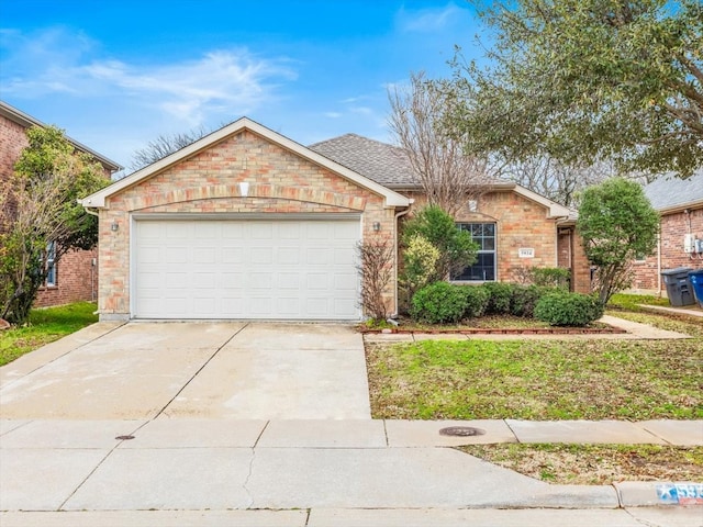 ranch-style house with a garage, brick siding, concrete driveway, and a shingled roof