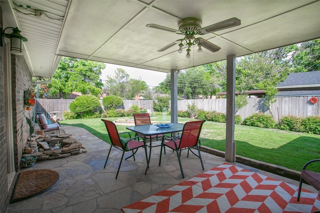 view of patio / terrace featuring a fenced backyard, outdoor dining space, and ceiling fan