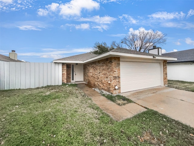 view of front of home with driveway, fence, a front yard, a garage, and brick siding