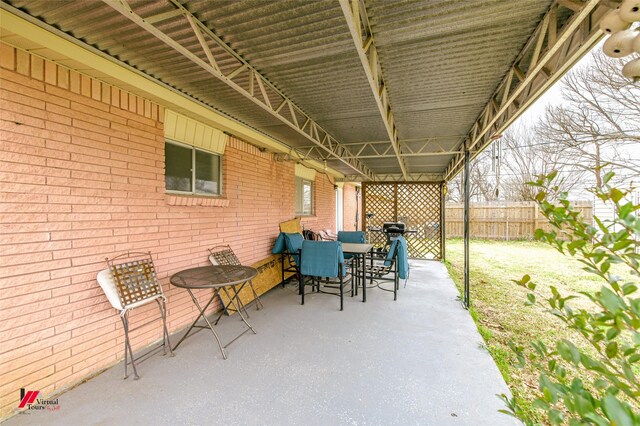 view of patio featuring fence