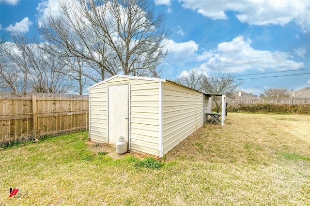 view of shed featuring fence