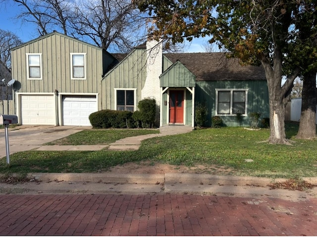 view of front of home with a front lawn, an attached garage, board and batten siding, and driveway