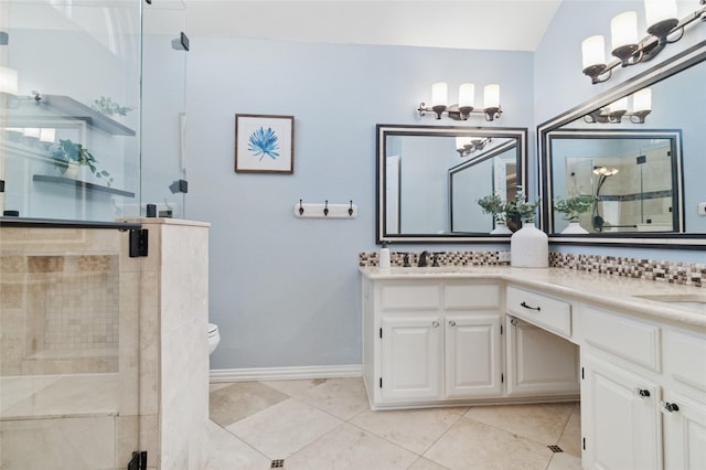 full bathroom with double vanity, toilet, a stall shower, and tile patterned flooring