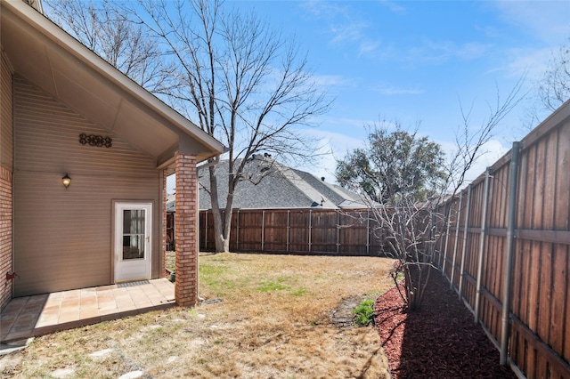 view of yard with a patio and a fenced backyard