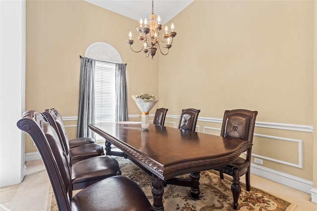 dining space with a notable chandelier and ornamental molding