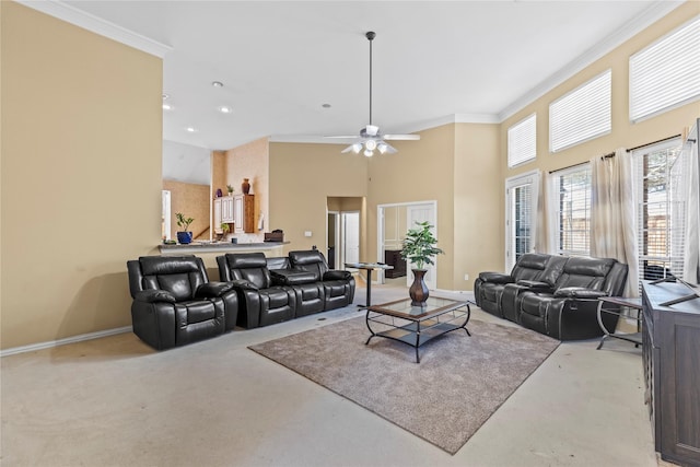 carpeted living room featuring ceiling fan, baseboards, a towering ceiling, and crown molding