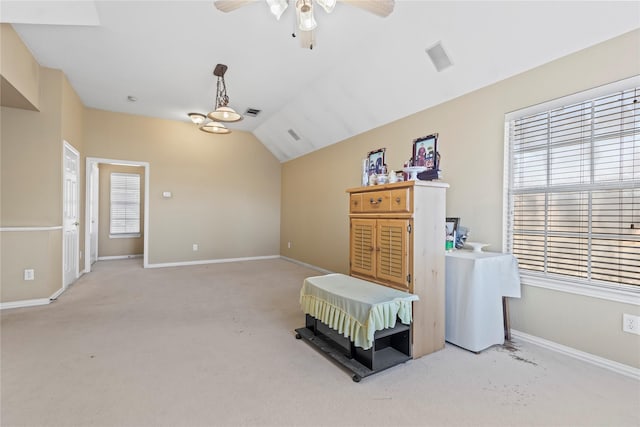 bedroom with baseboards, light carpet, and lofted ceiling