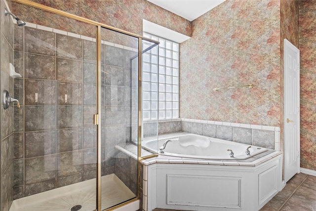 bathroom with baseboards, wallpapered walls, a shower stall, tile patterned floors, and a bath