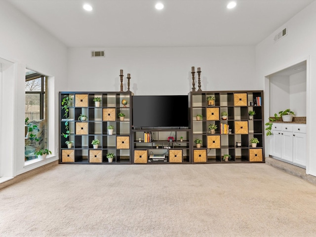 carpeted living room featuring recessed lighting and visible vents