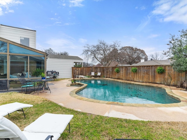 view of pool featuring a fenced in pool, a fenced backyard, and a patio area