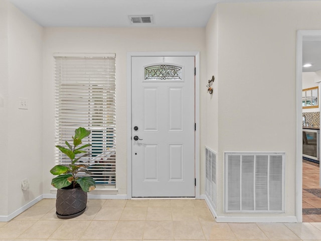 3320 Canyon Valley Trl, Plano, TX 75023 - tiled entrance foyer featuring baseboards, wine cooler, and visible vents