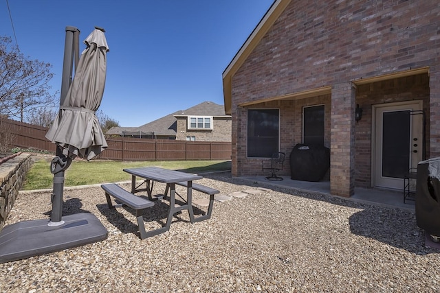 view of yard with a patio and a fenced backyard