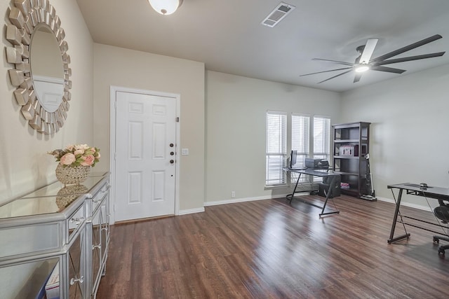 foyer with visible vents, ceiling fan, dark wood-type flooring, and baseboards