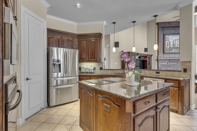 kitchen with light tile patterned floors, black electric cooktop, a kitchen island, and stainless steel refrigerator with ice dispenser