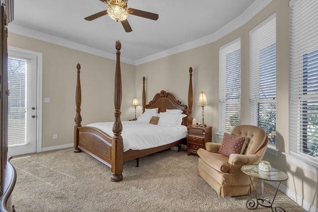 carpeted bedroom featuring a ceiling fan, baseboards, and ornamental molding