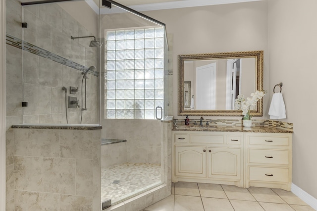 full bathroom featuring vanity, a shower stall, and tile patterned floors