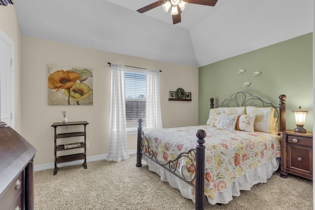 bedroom with light colored carpet, baseboards, lofted ceiling, and a ceiling fan