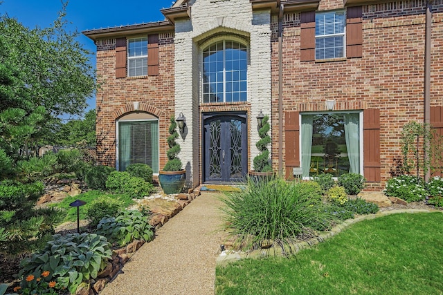 entrance to property with french doors and brick siding