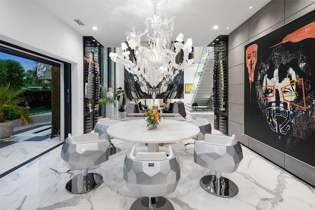 dining room featuring a chandelier, recessed lighting, marble finish floor, and visible vents