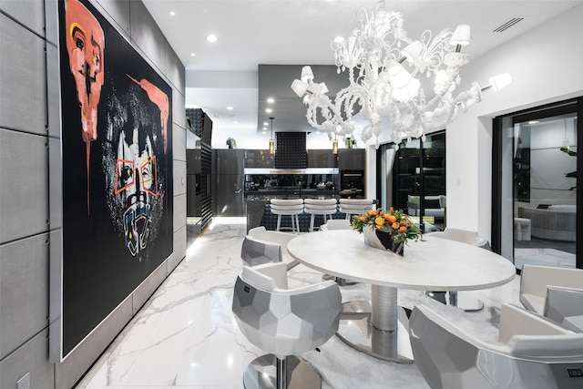 dining area featuring a chandelier, visible vents, marble finish floor, and recessed lighting