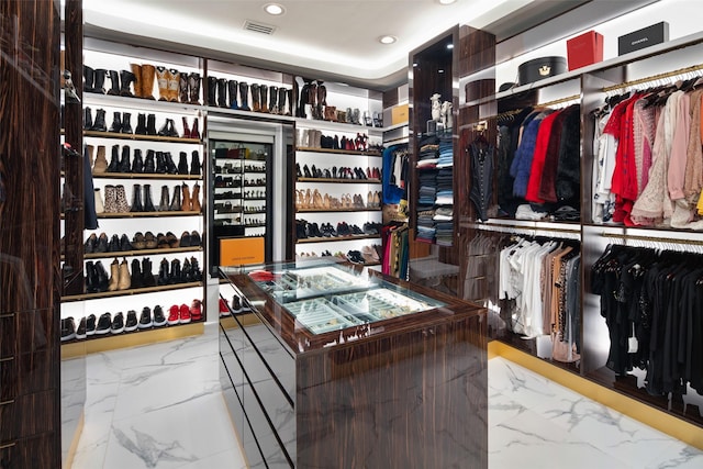 interior space featuring visible vents and marble finish floor