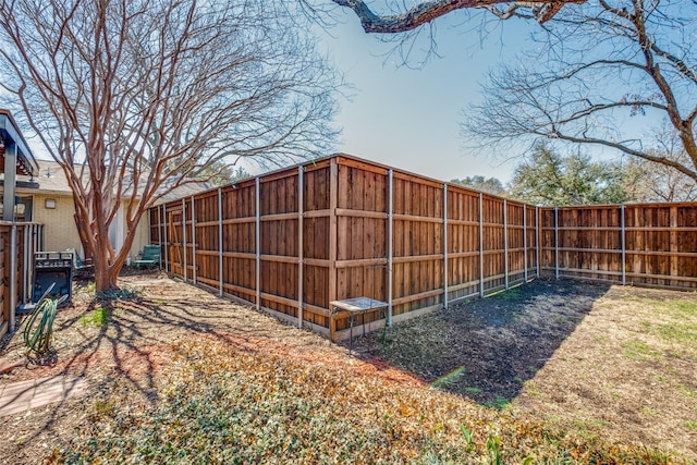 view of yard with a fenced backyard