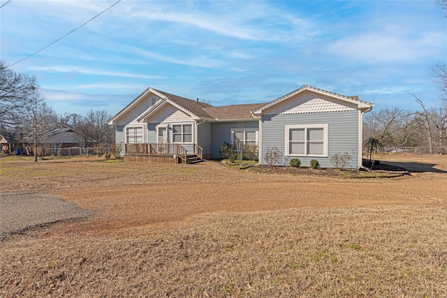 view of front of house with a wooden deck