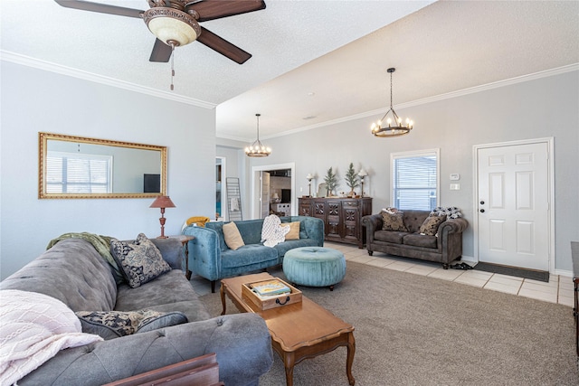 living area with light tile patterned floors, ceiling fan with notable chandelier, light carpet, and ornamental molding