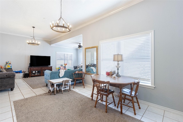 dining room with tile patterned floors, baseboards, ornamental molding, and ceiling fan with notable chandelier