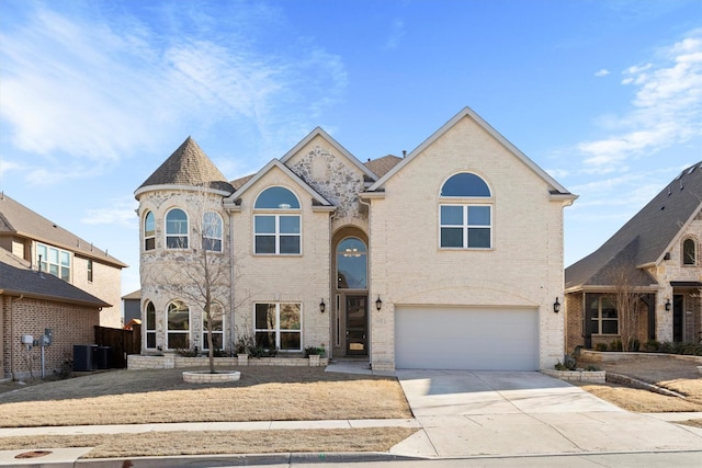 view of front facade with brick siding, cooling unit, an attached garage, and concrete driveway