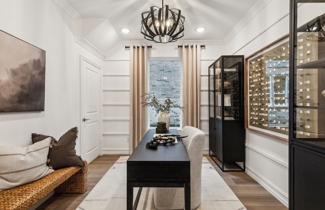 interior space with a chandelier and wood finished floors