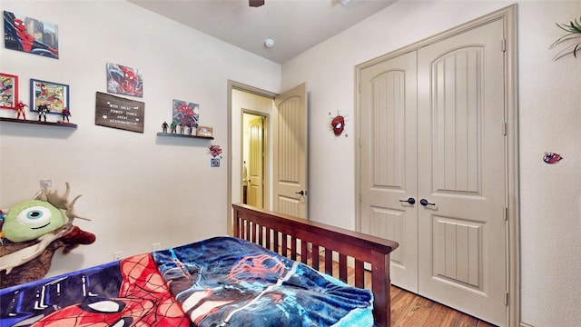 bedroom featuring wood finished floors and a closet