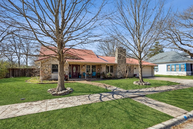 ranch-style house featuring a garage, driveway, a chimney, and a front lawn