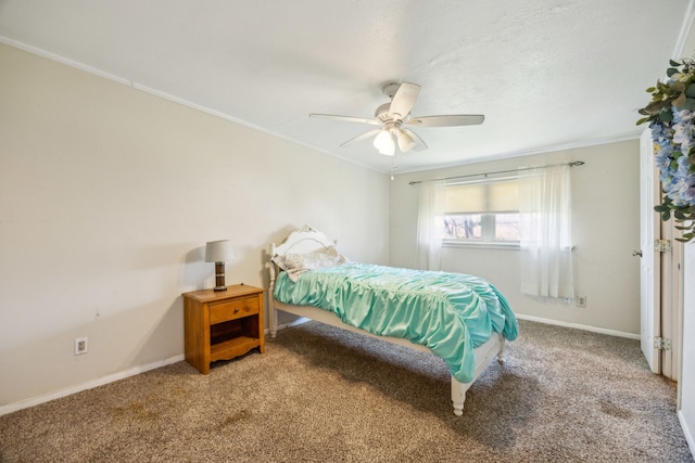 bedroom with crown molding, carpet, and baseboards