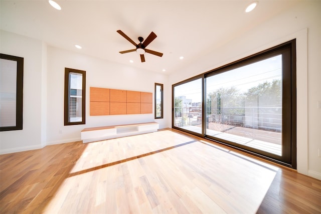 spare room featuring recessed lighting and light wood-style flooring