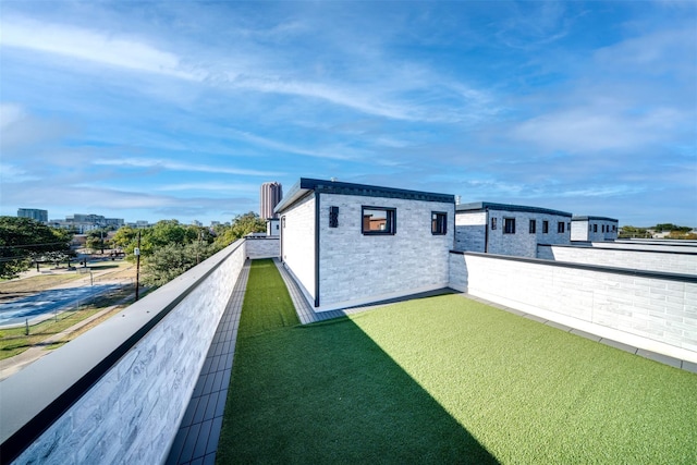 view of yard featuring a balcony