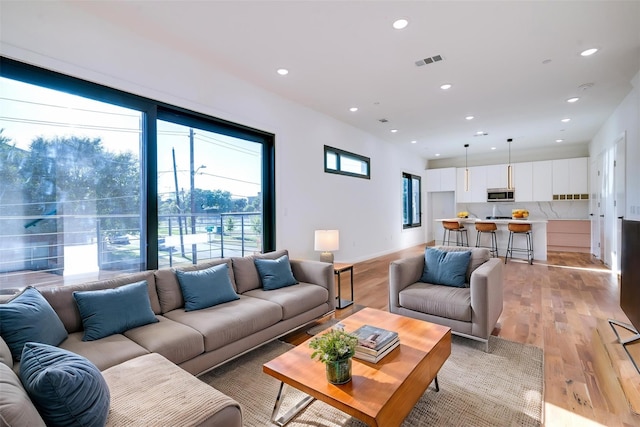 1920 Caddo St Unit 103, Dallas, TX 75204 - living room featuring recessed lighting and light wood-style flooring