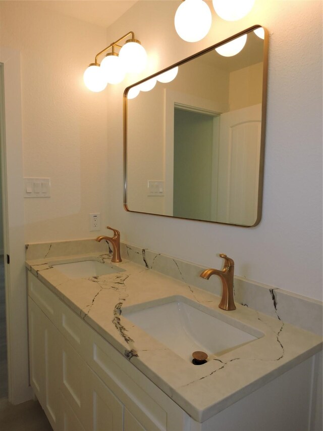 bathroom with double vanity and a sink