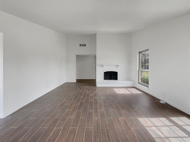 kitchen with wood finish floors, custom range hood, appliances with stainless steel finishes, french doors, and white cabinets