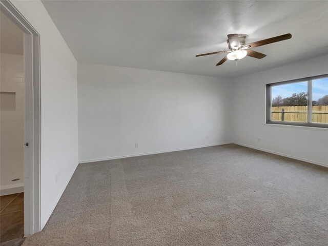 unfurnished bedroom with visible vents, two closets, carpet floors, baseboards, and ceiling fan