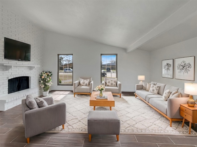 living area featuring a brick fireplace and vaulted ceiling with beams