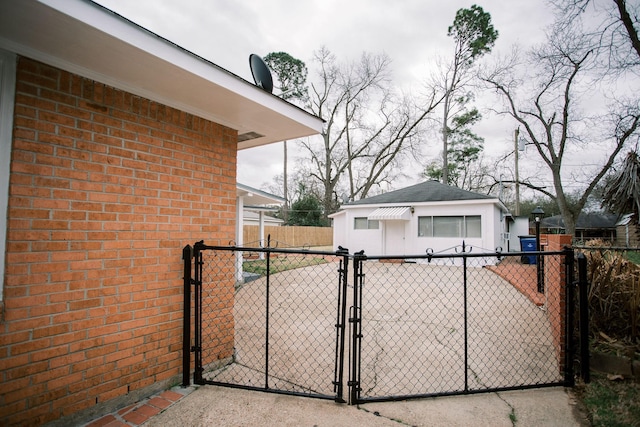 view of gate with fence