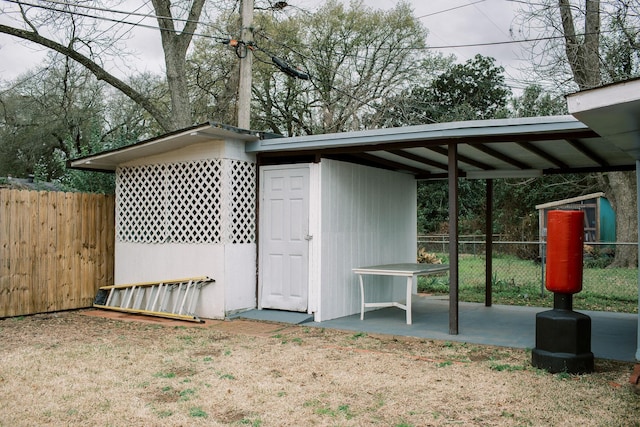 view of outdoor structure with an outdoor structure and fence