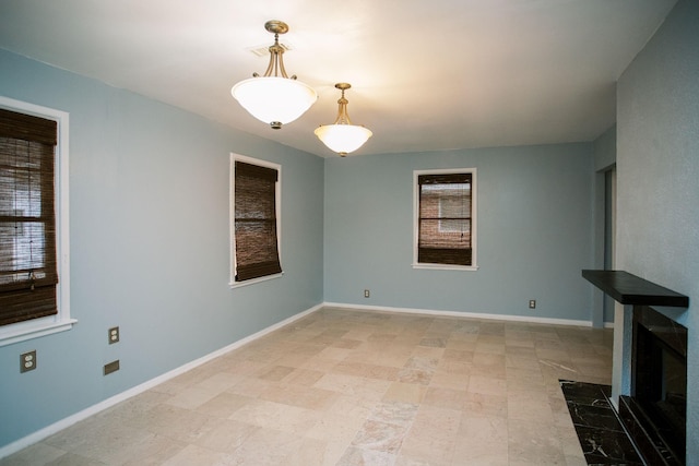 unfurnished living room with visible vents and baseboards