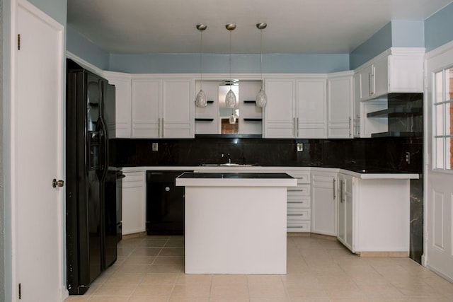 kitchen featuring decorative backsplash, black appliances, and white cabinetry