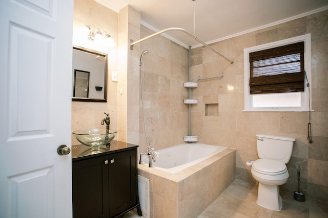 full bathroom with tile patterned flooring, toilet, vanity, tiled shower / bath combo, and tile walls