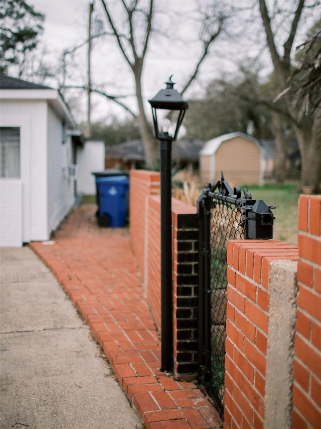 view of gate featuring fence