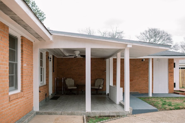 view of patio / terrace with a carport and ceiling fan